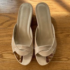Stuart Weitzman wedged sandals.